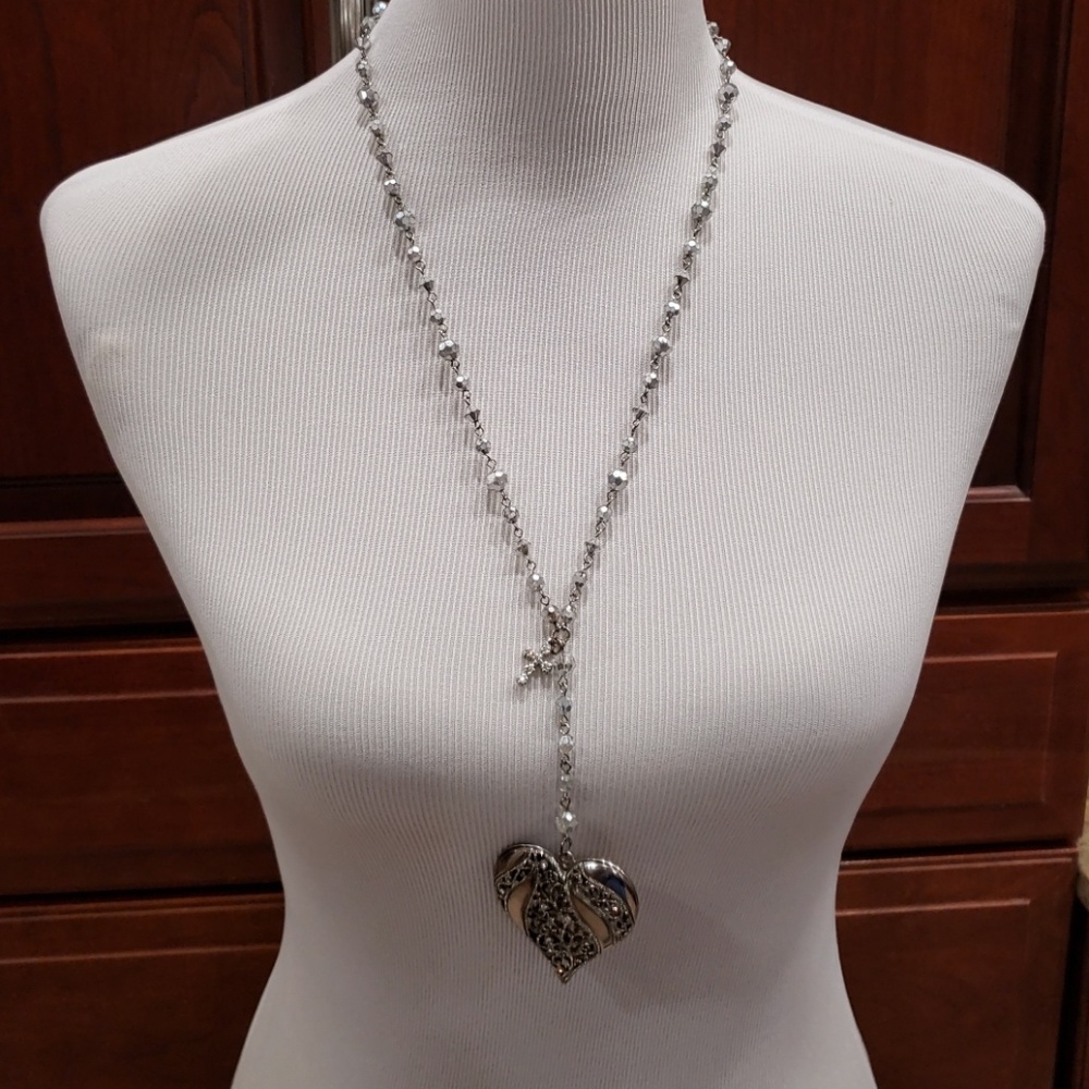 Necklace with bronze and silver heart pendant